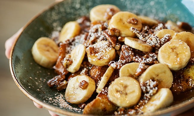 Bananas foster french toast drizzled with caramel