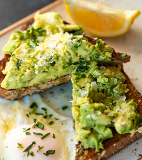 Avocado toast and eggs on a plate.